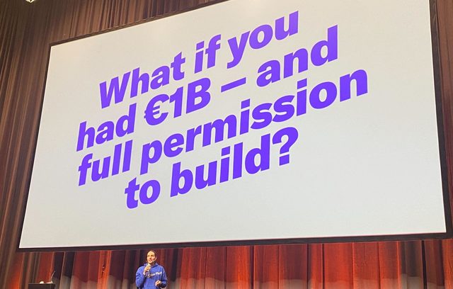 Johannes on stage at EurIPS 2025 under a slide asking: What if you had €1B and full permission to build?